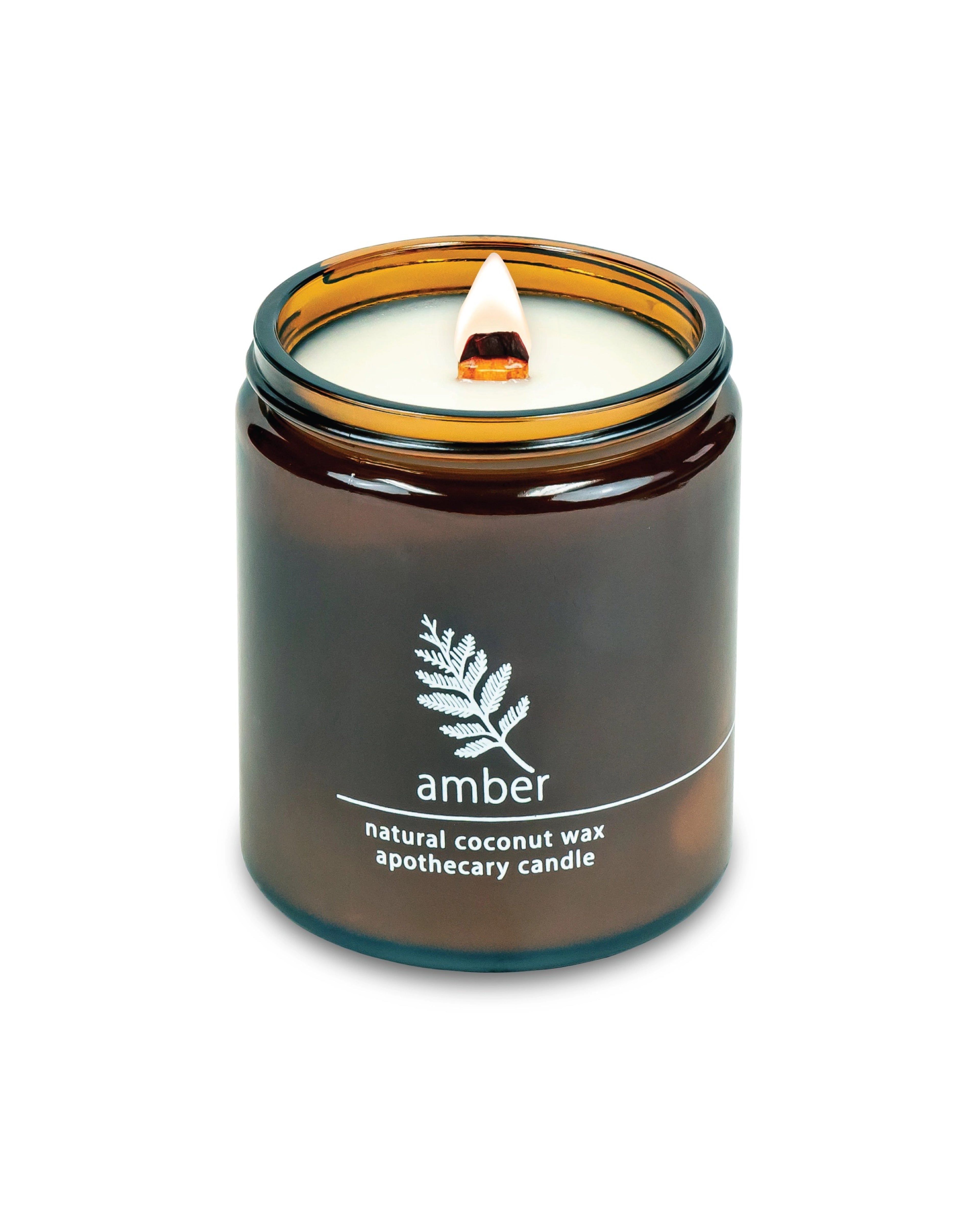 Candle in an amber jar on a white background