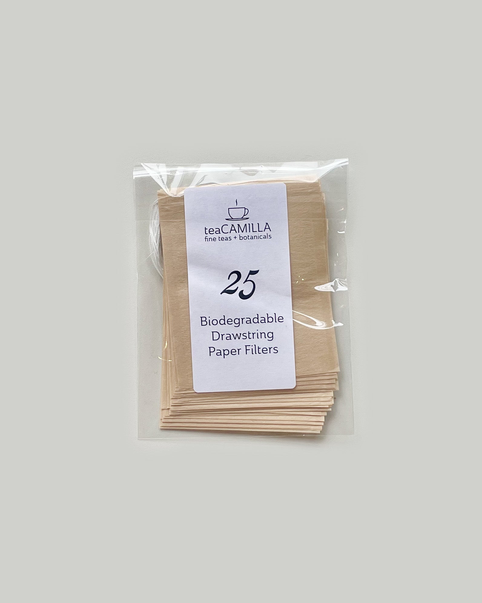 Pack of biodegradable paper filters with Tea Camilla branding on a plain background
