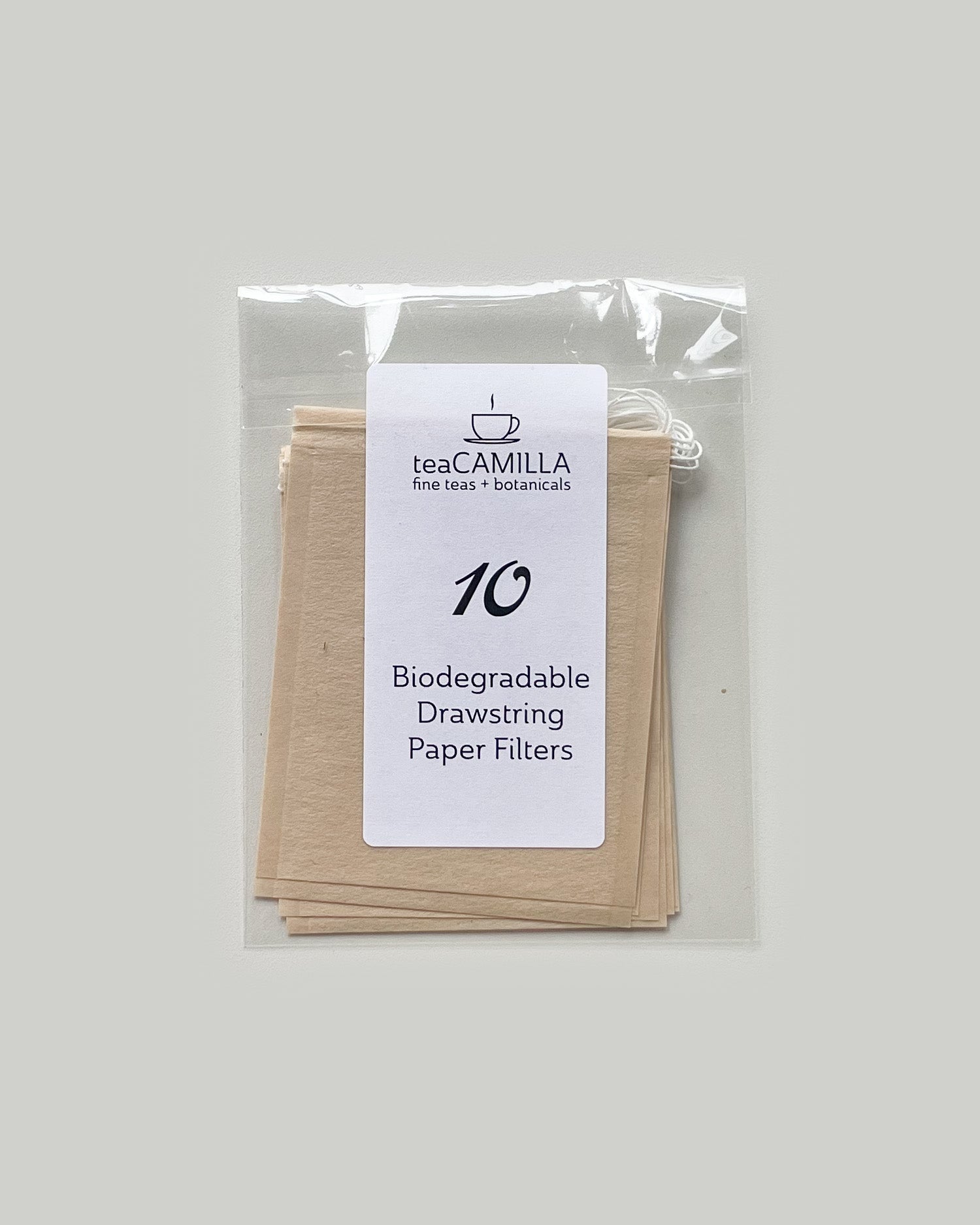 Pack of biodegradable drawstring paper filters from Tea Camilla on a plain background