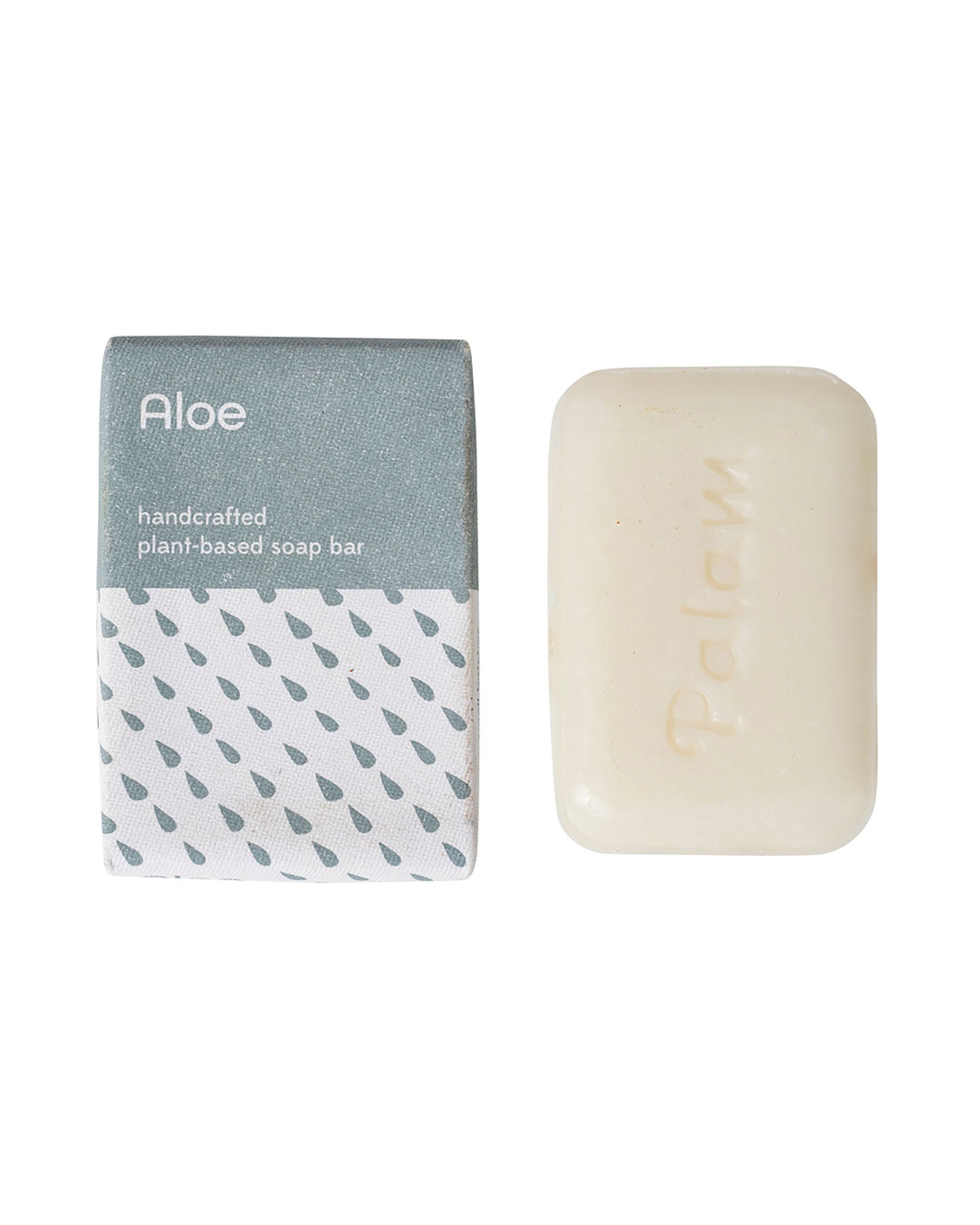 Handcrafted aloe soap bar with packaging on a white background
