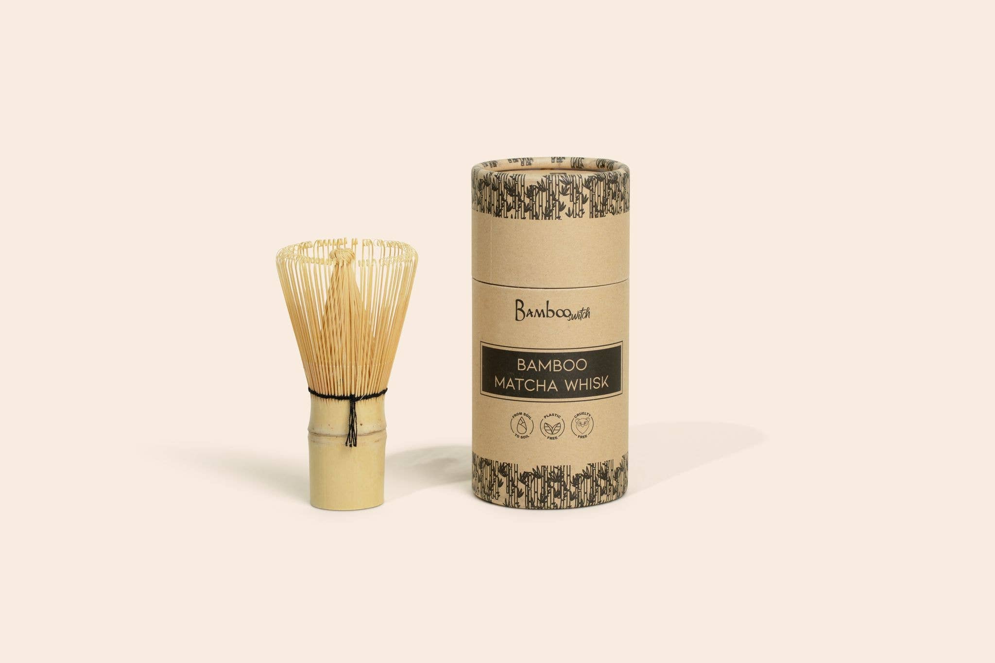 Bamboo matcha whisk and its packaging on a beige background