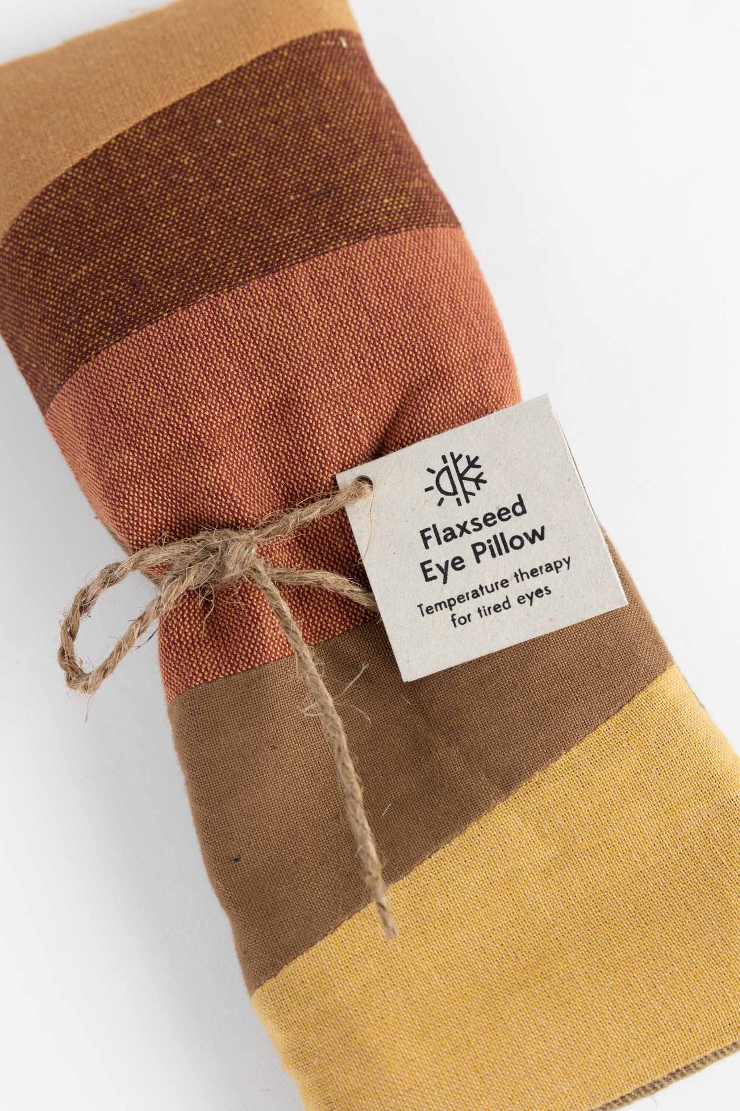 Flaxseed eye pillow with a label on a white background
