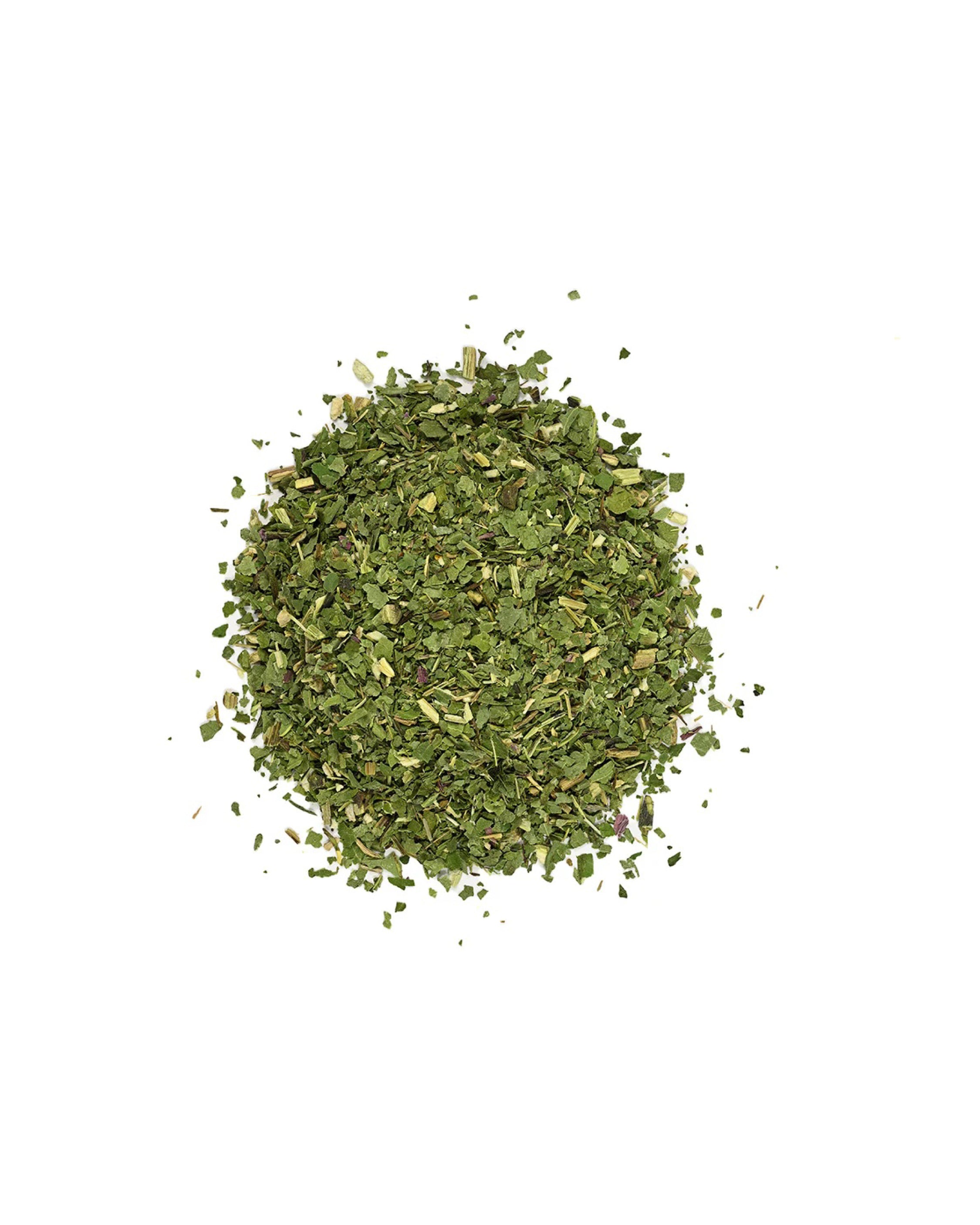 Pile of dried green herbs on a white background