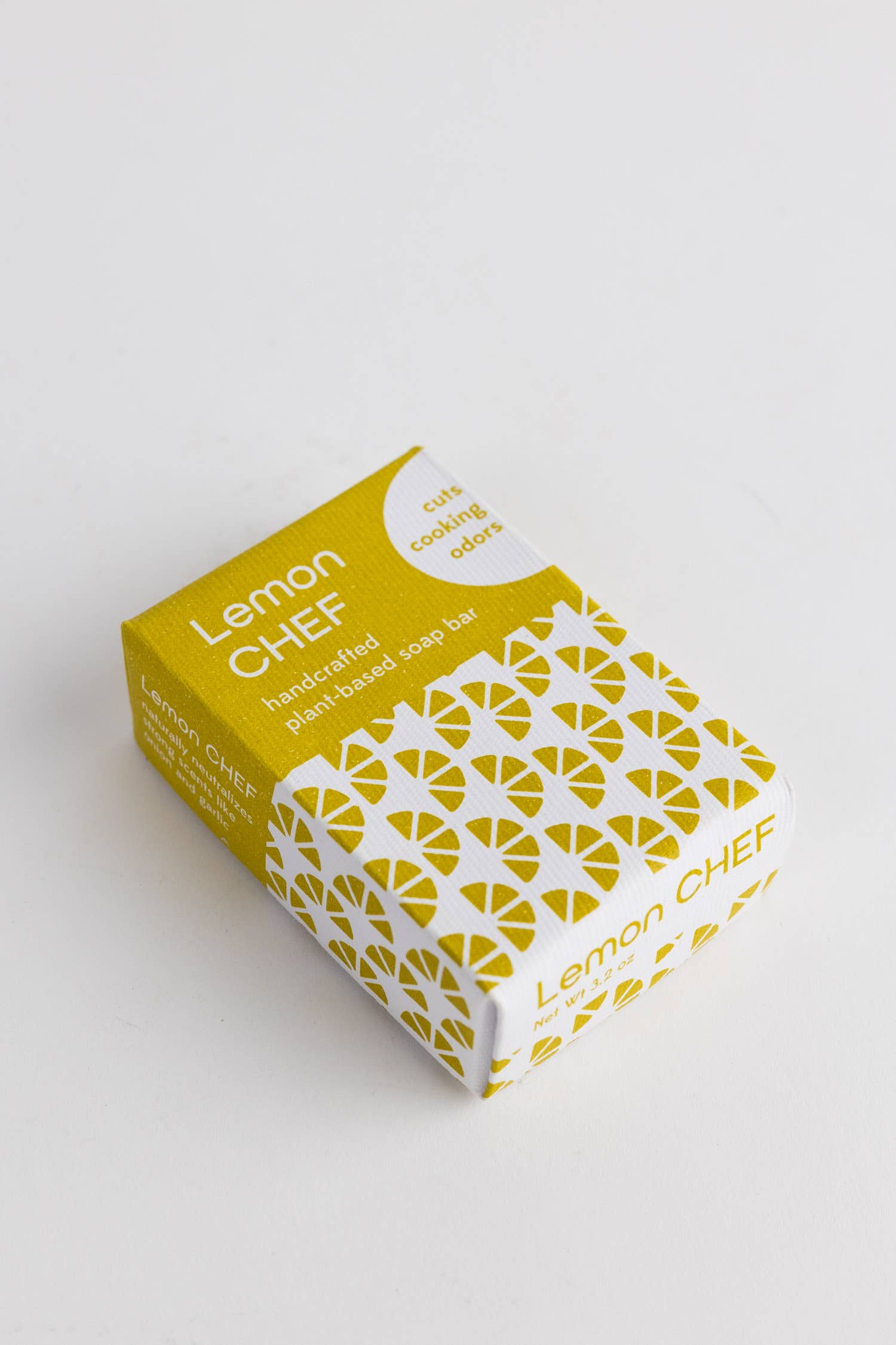 Yellow and white box of Lemon Chef soap on a light gray background