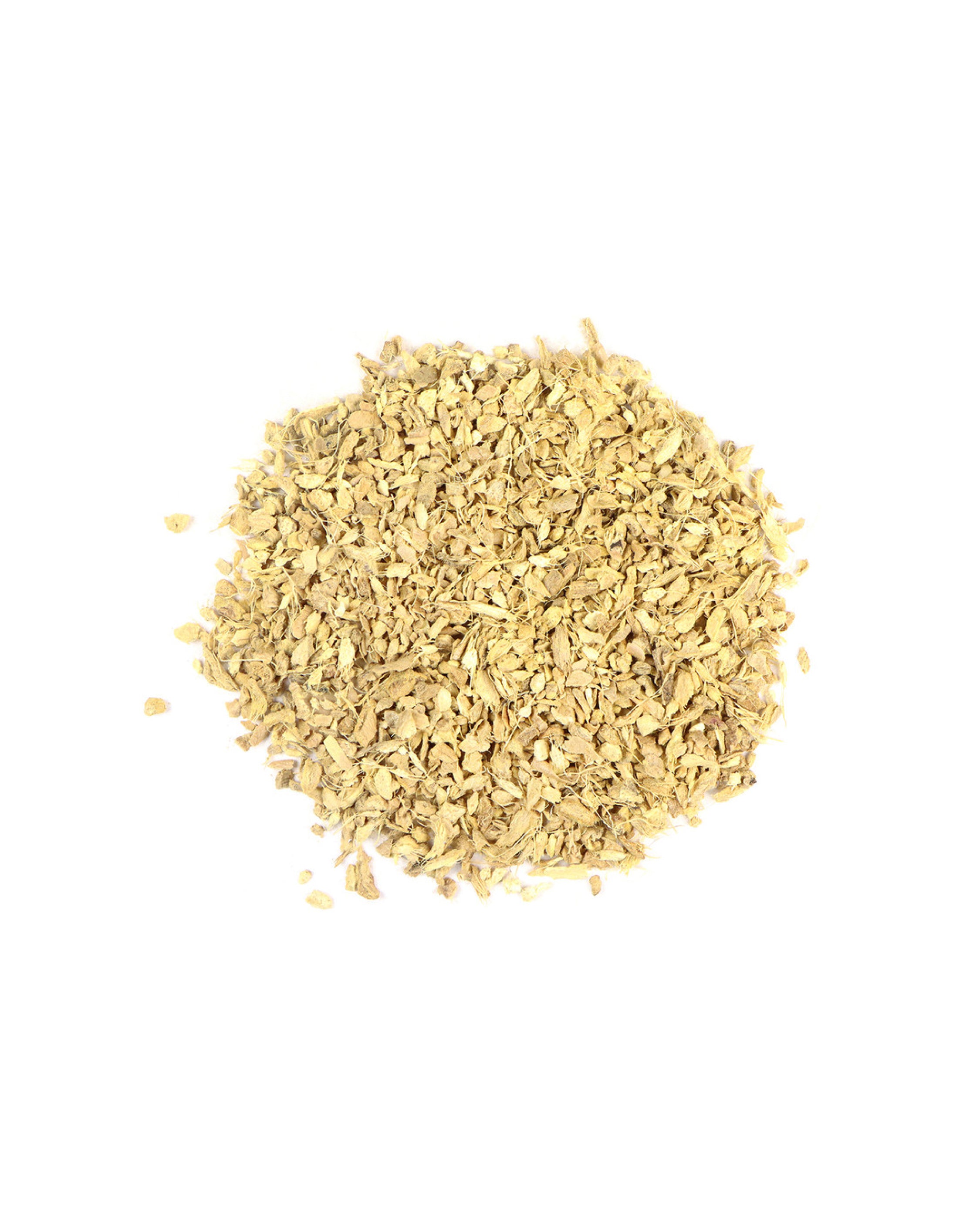 Pile of dried ginger roots on a white background