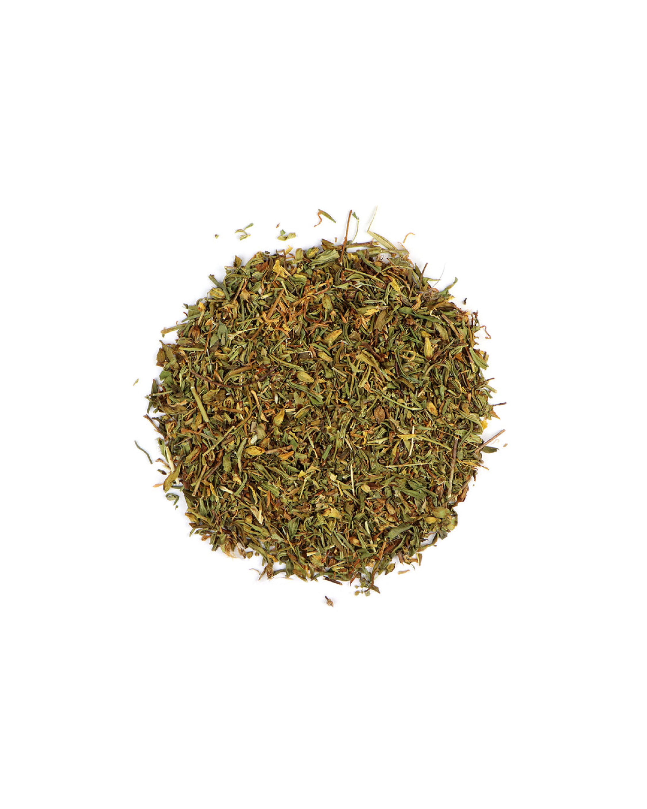 Pile of dried herbs on a white background