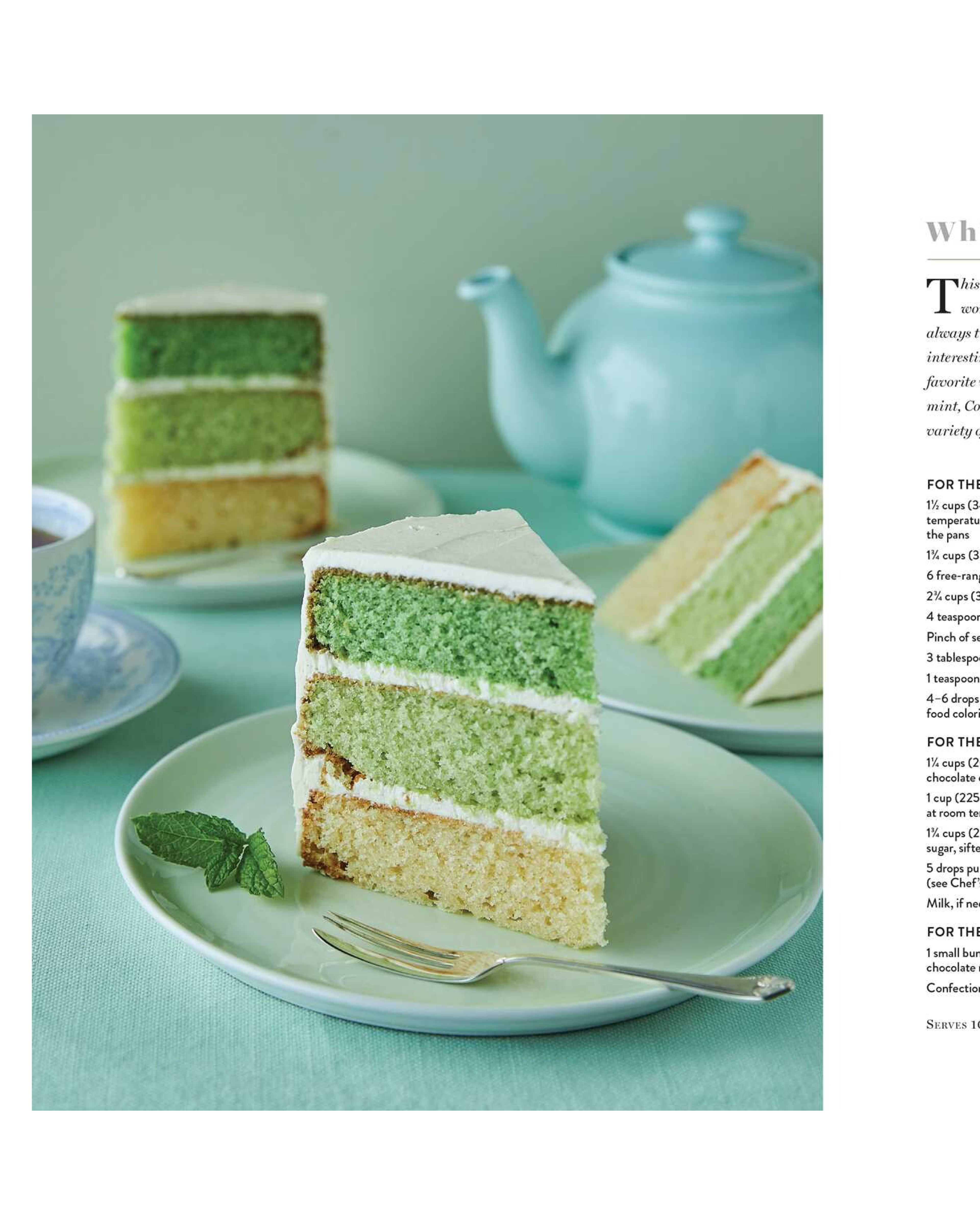 Slice of green layered cake on a plate with a teapot in the background