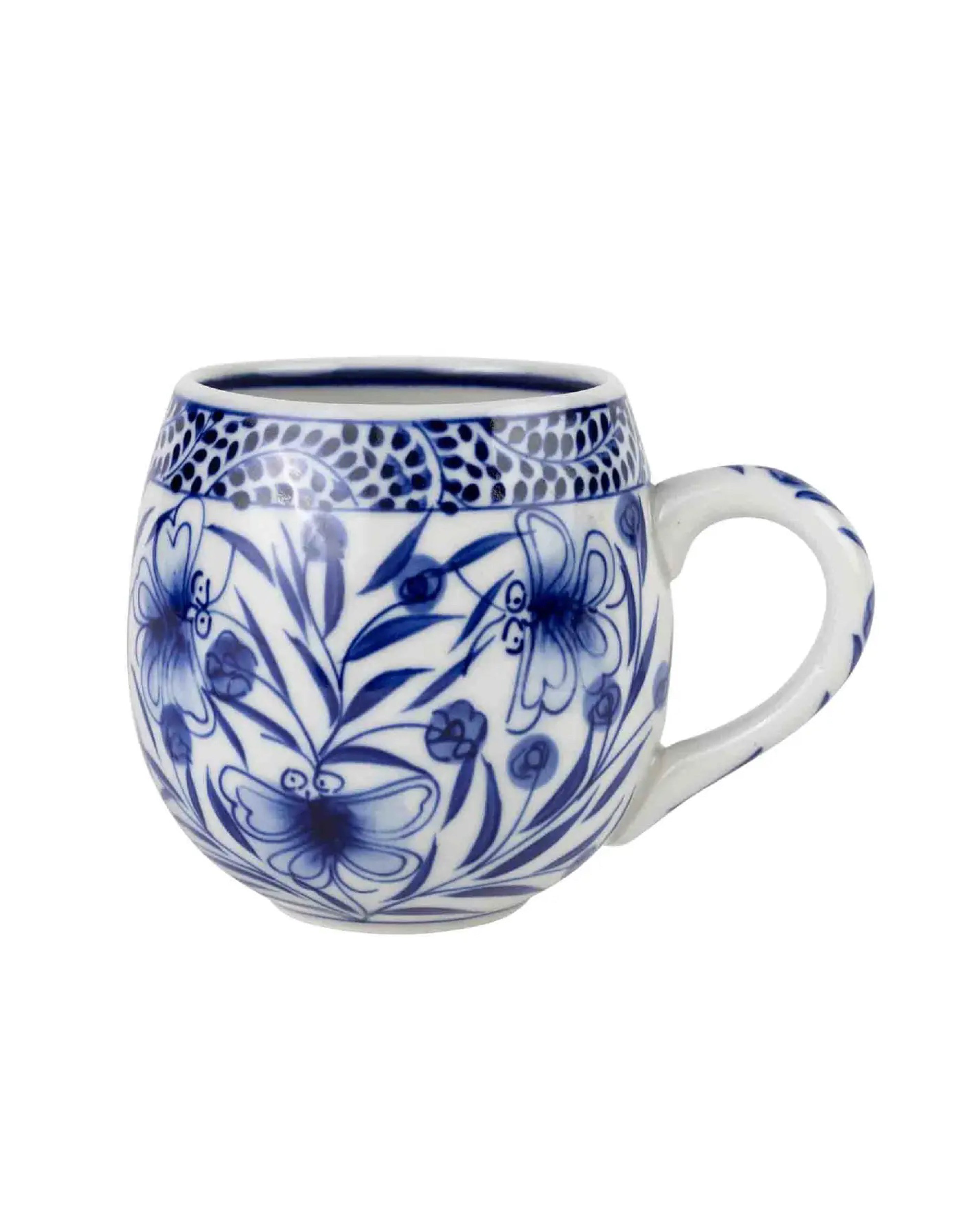 Ceramic mug with blue floral pattern on a white background