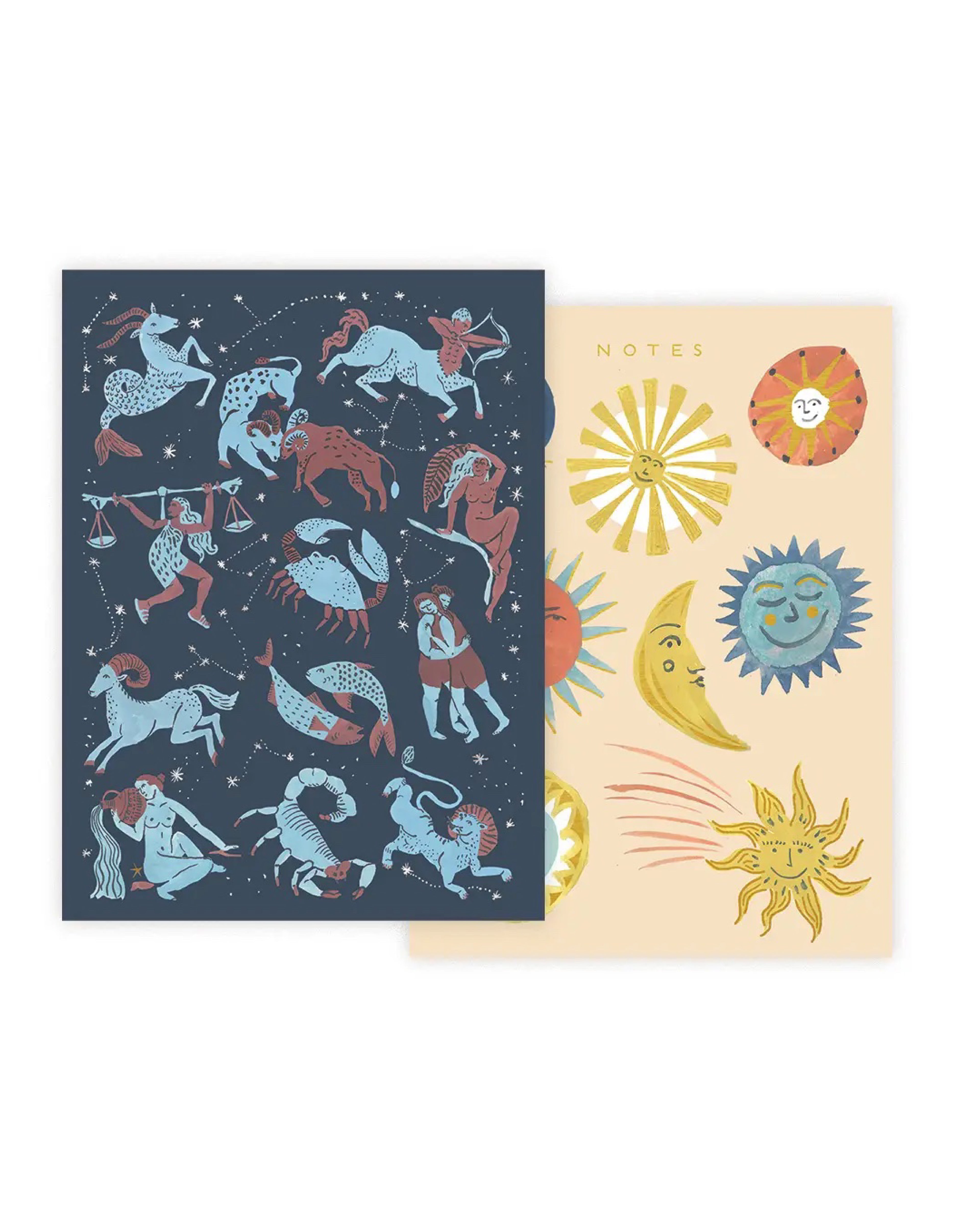 Two notebooks with zodiac designs on a white background