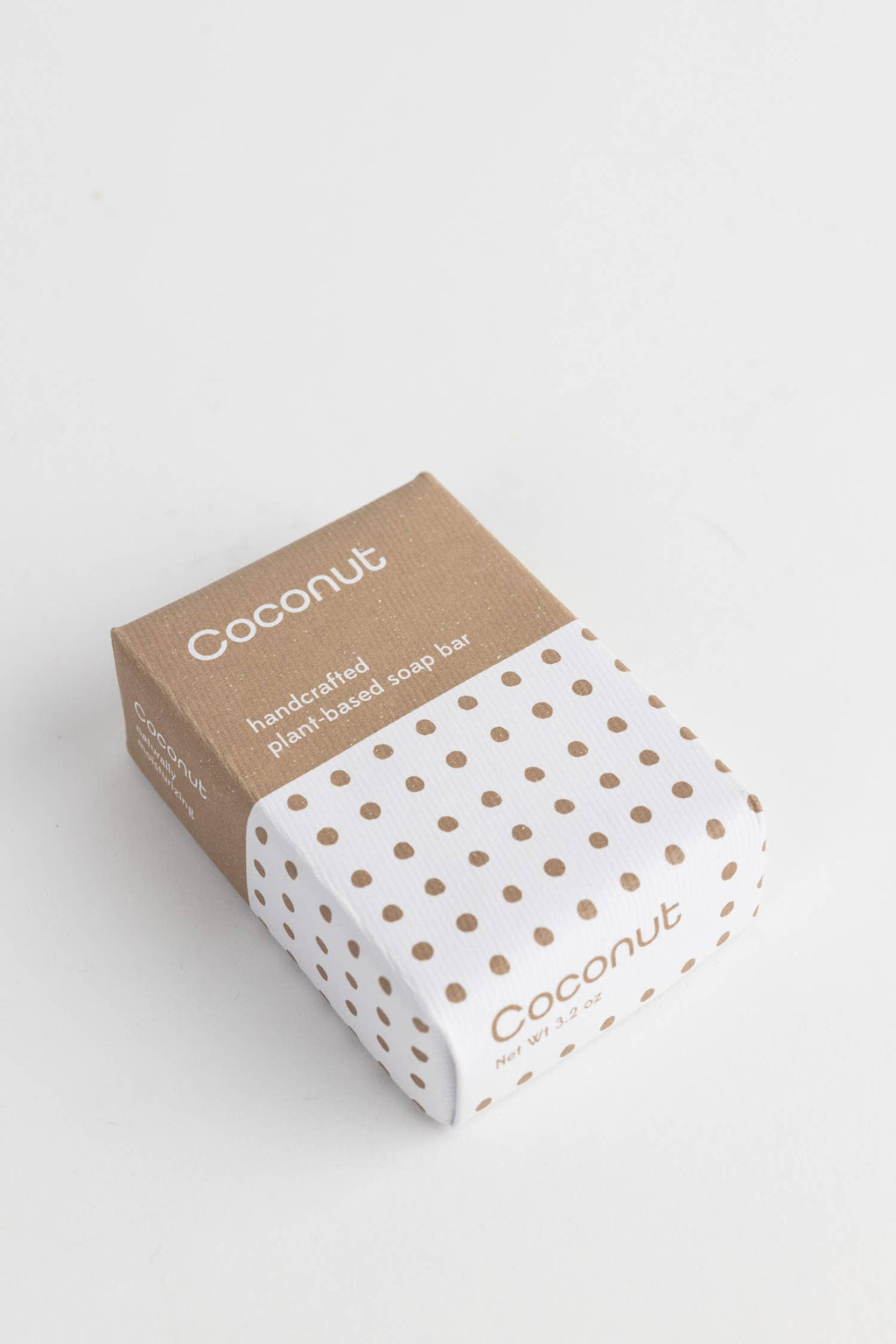 Soap bar with coconut text on a white background