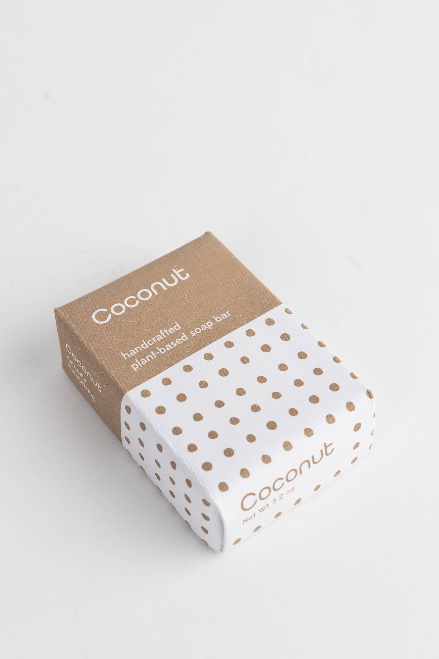 Soap bar with coconut text on a white background