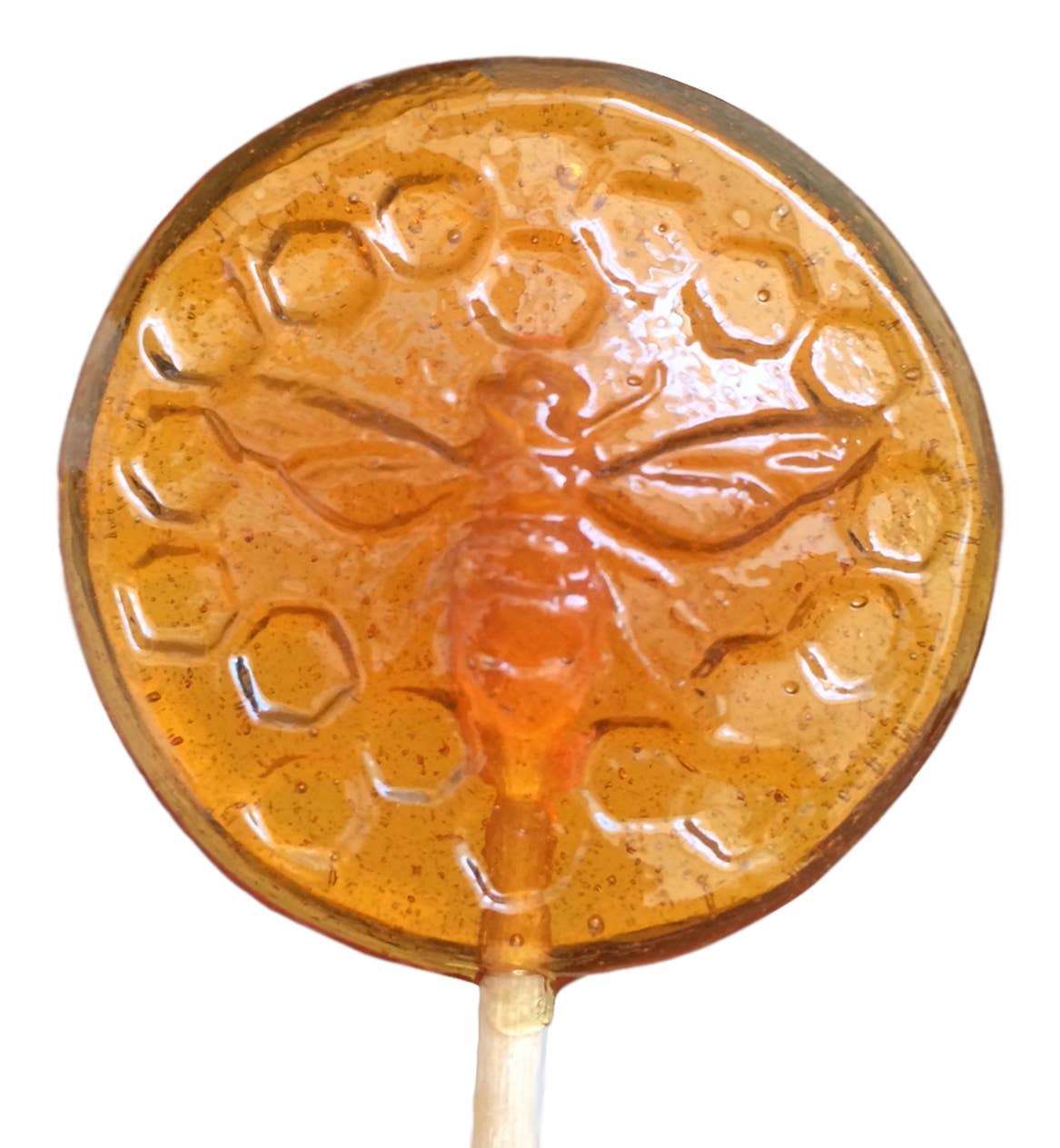 Round honey-colored lollipop with a stick on a white background