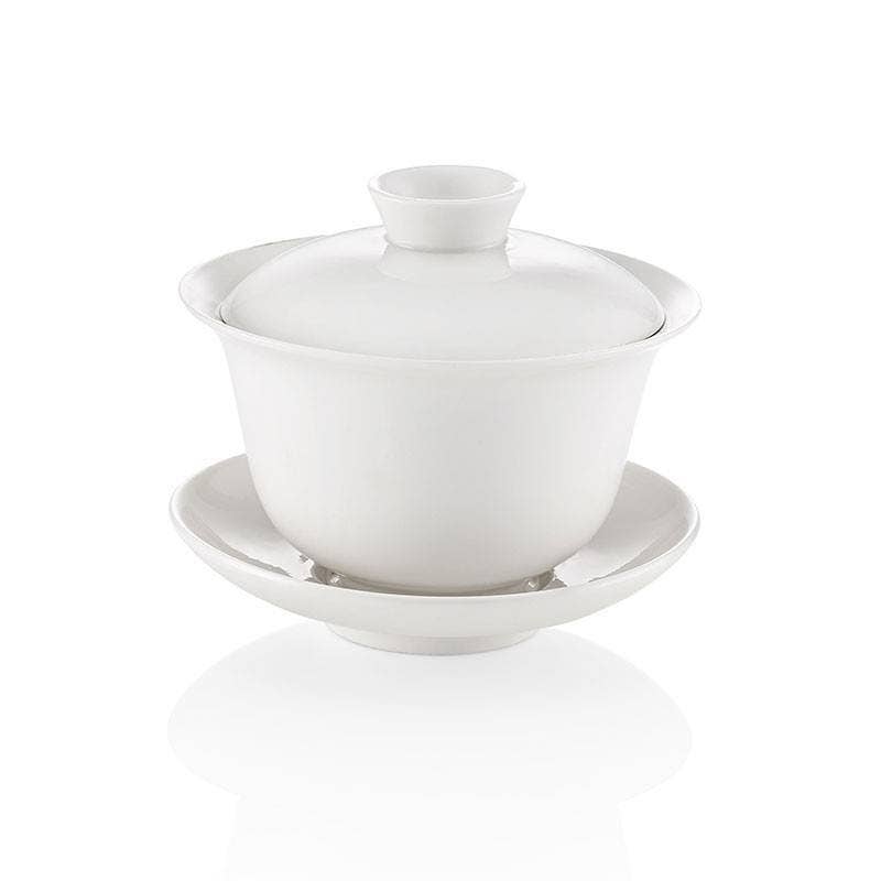 White ceramic teapot with lid on a white background
