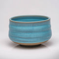 Blue ceramic bowl on a white background