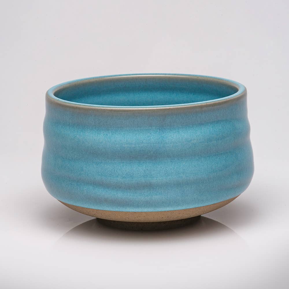 Blue ceramic bowl on a white background