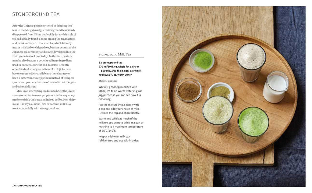 Wooden tray with various stoneground tea preparations on a white background