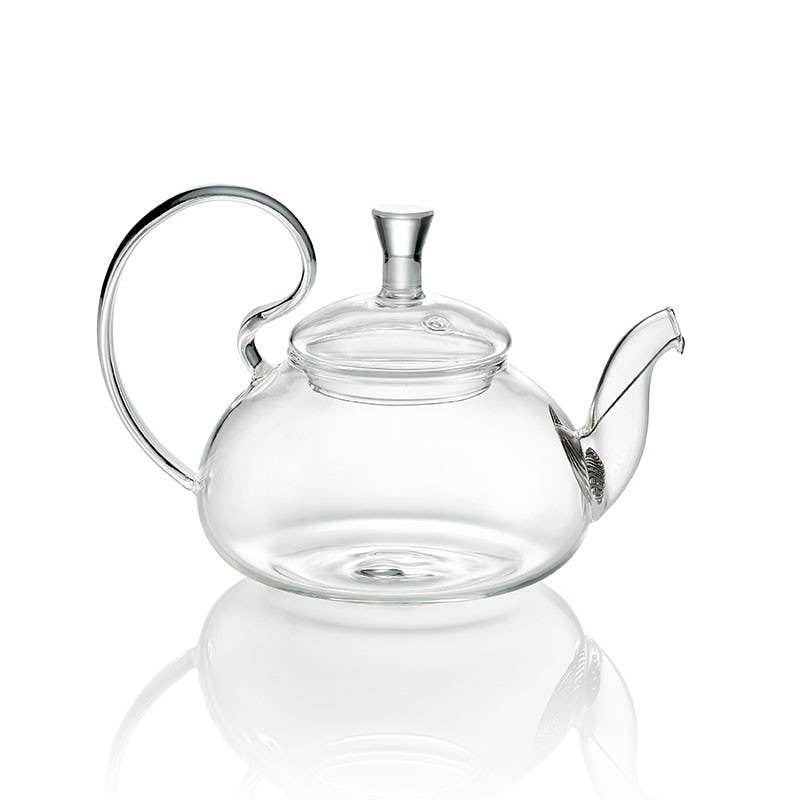 Clear glass teapot on a white background