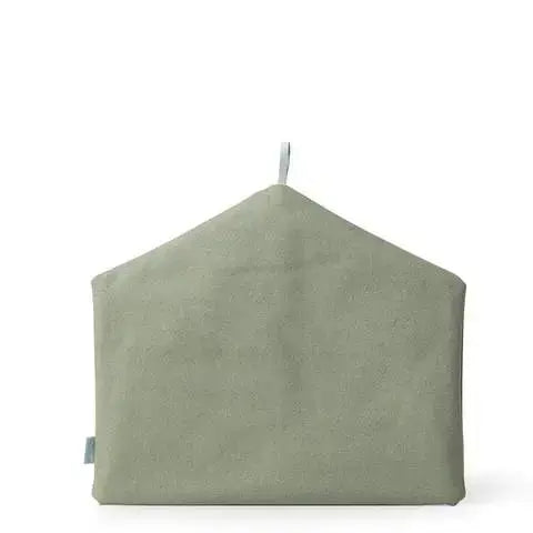 Green cushion with a tag on a white background