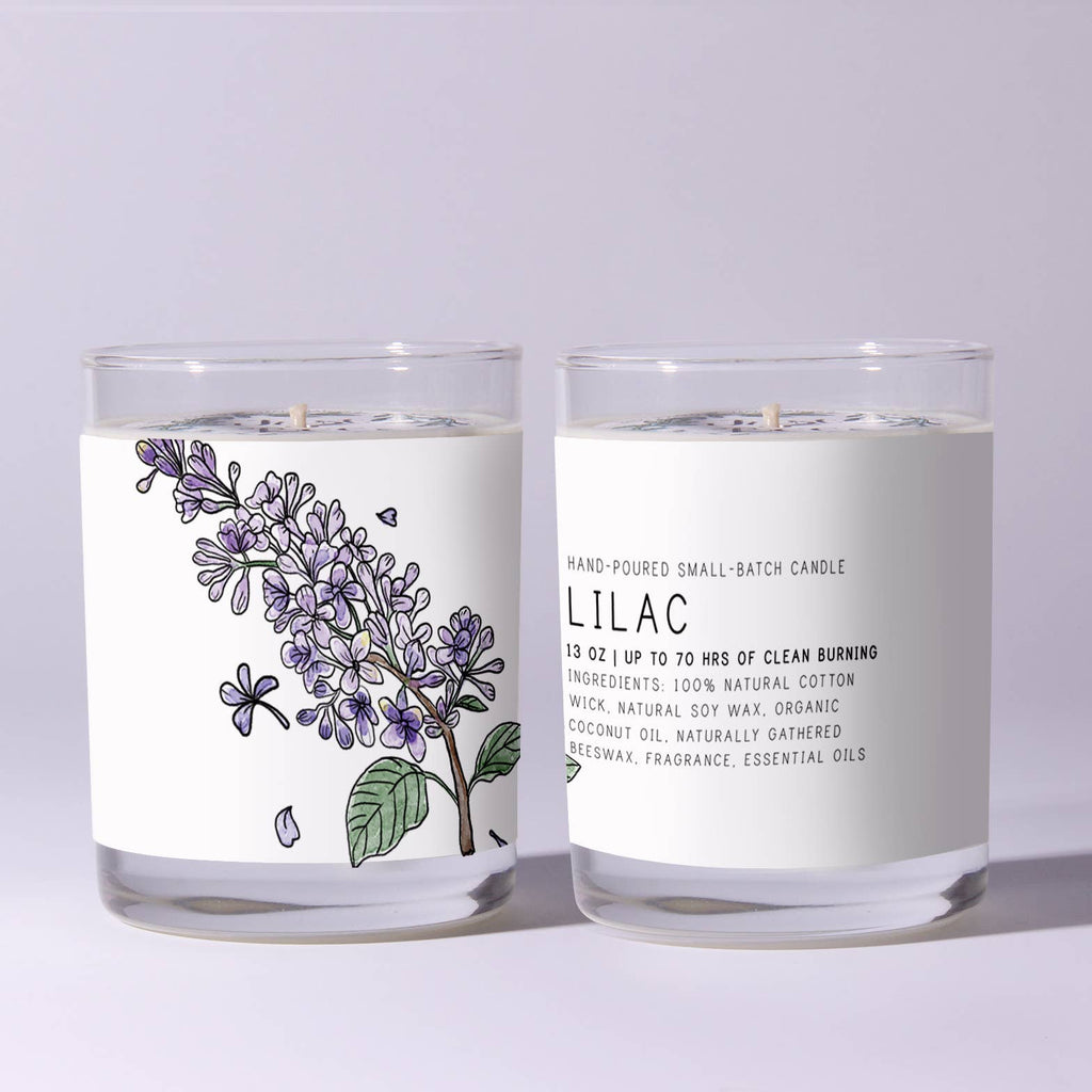 Two lilac-scented candles with labels on a light gray background