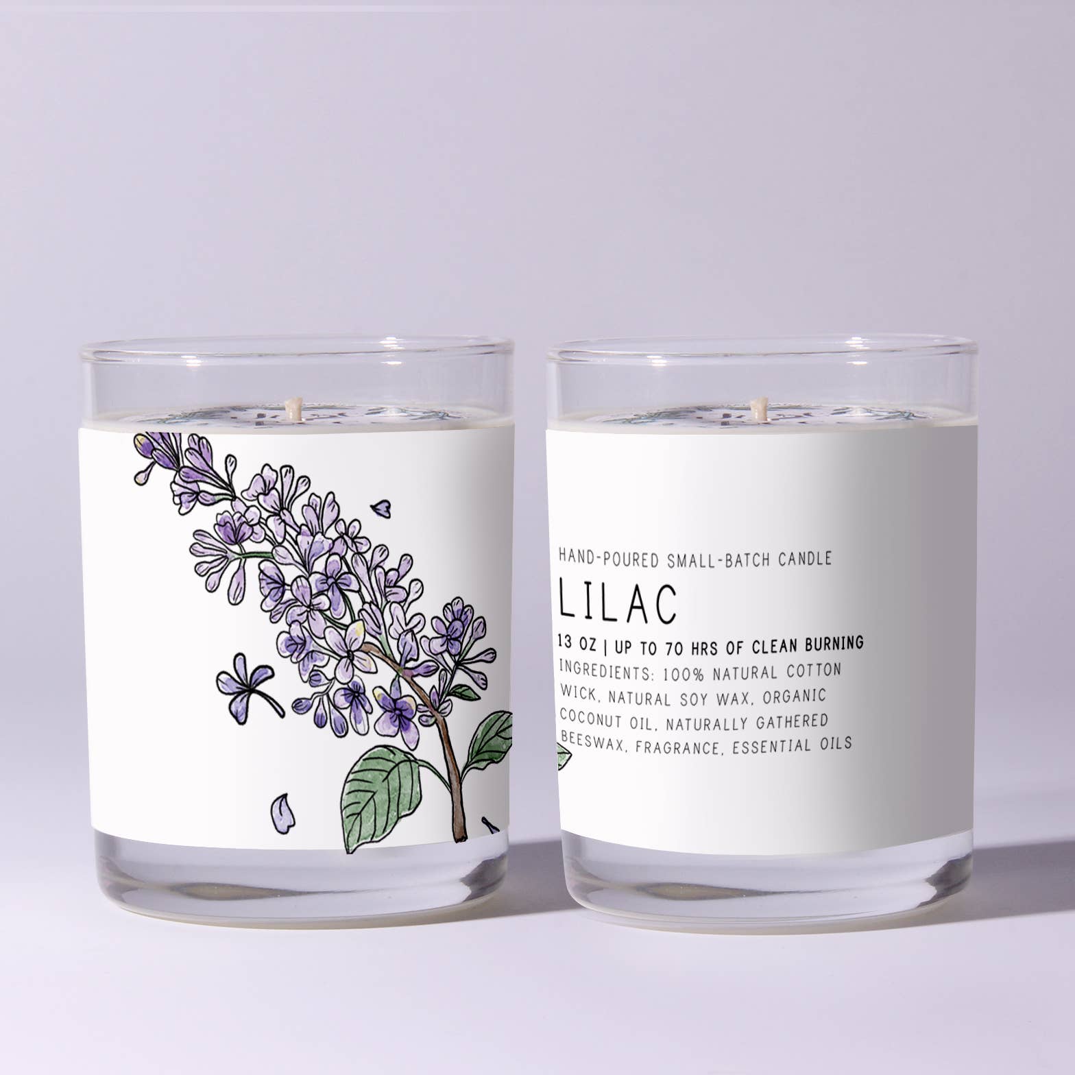 Two lilac-scented candles with labels on a light gray background