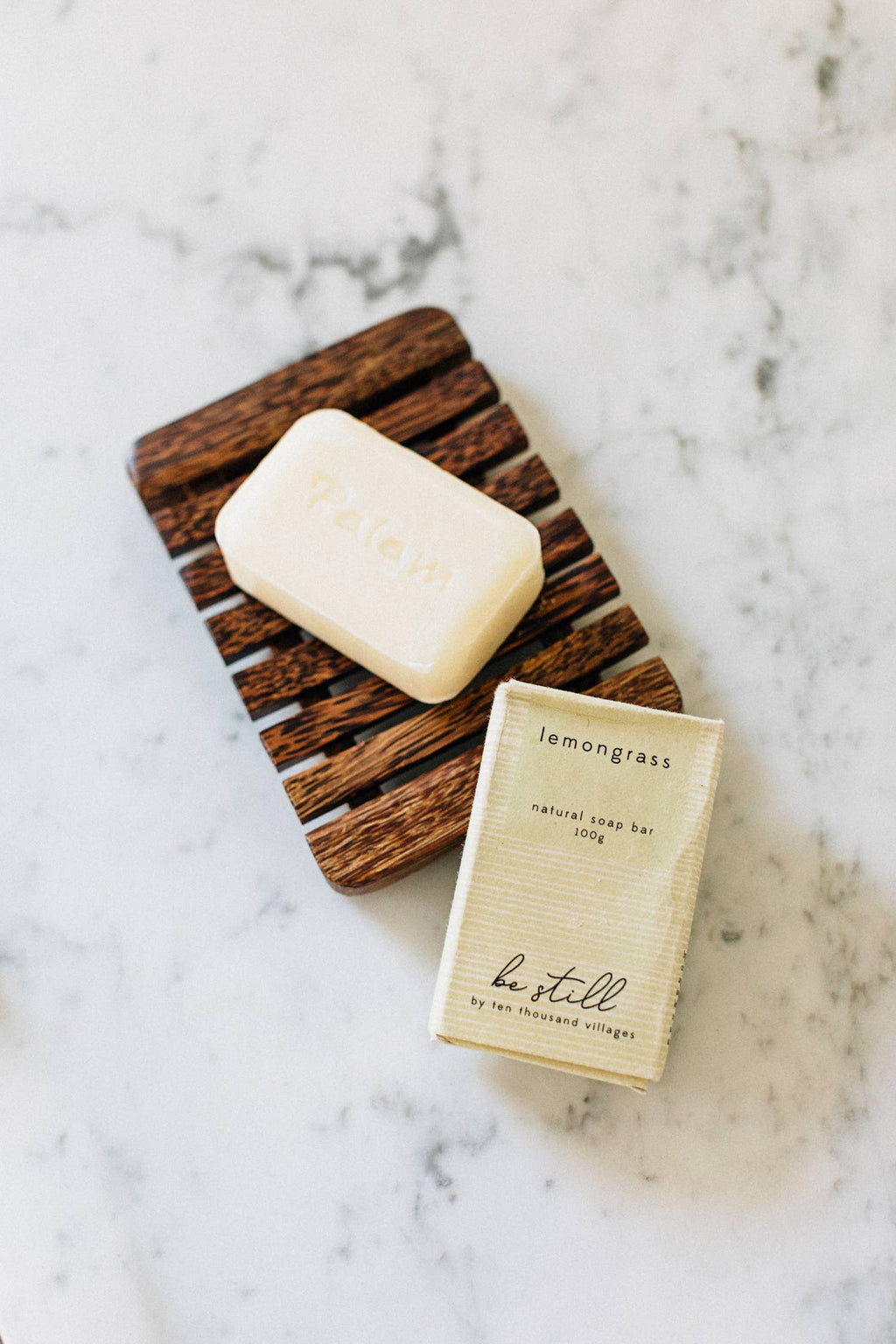 Bar of soap on a wooden soap dish