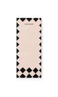 Notebook with black and white geometric pattern on a white background