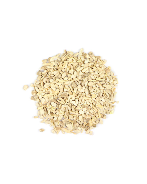 Small pile of light brown dried herbs on a white background