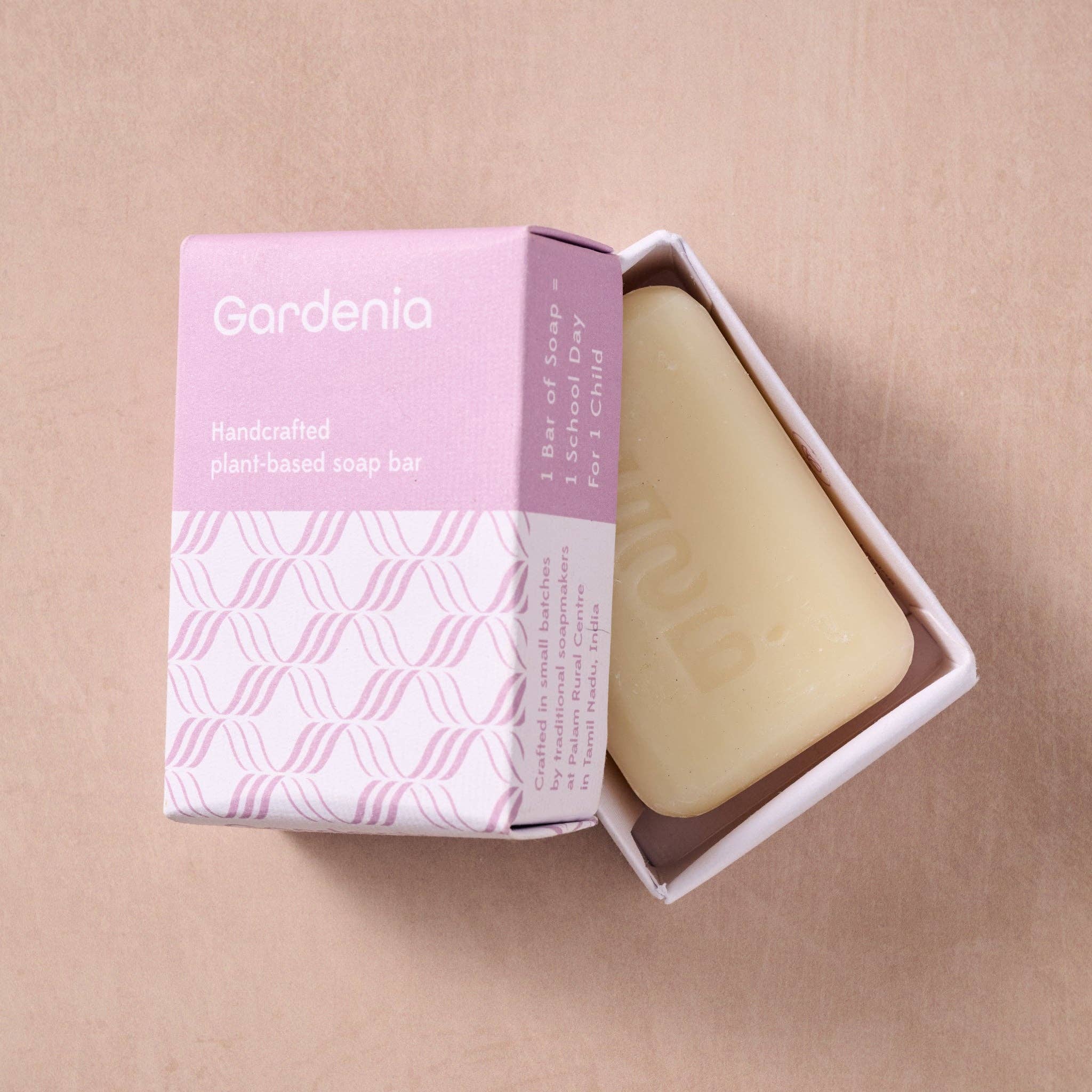 Bar of soap with 'Gardenia' packaging on a beige background