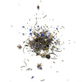 Heap of tea leaves scattered on a white background
