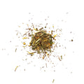 Heap of tea leaves scattered on a white background