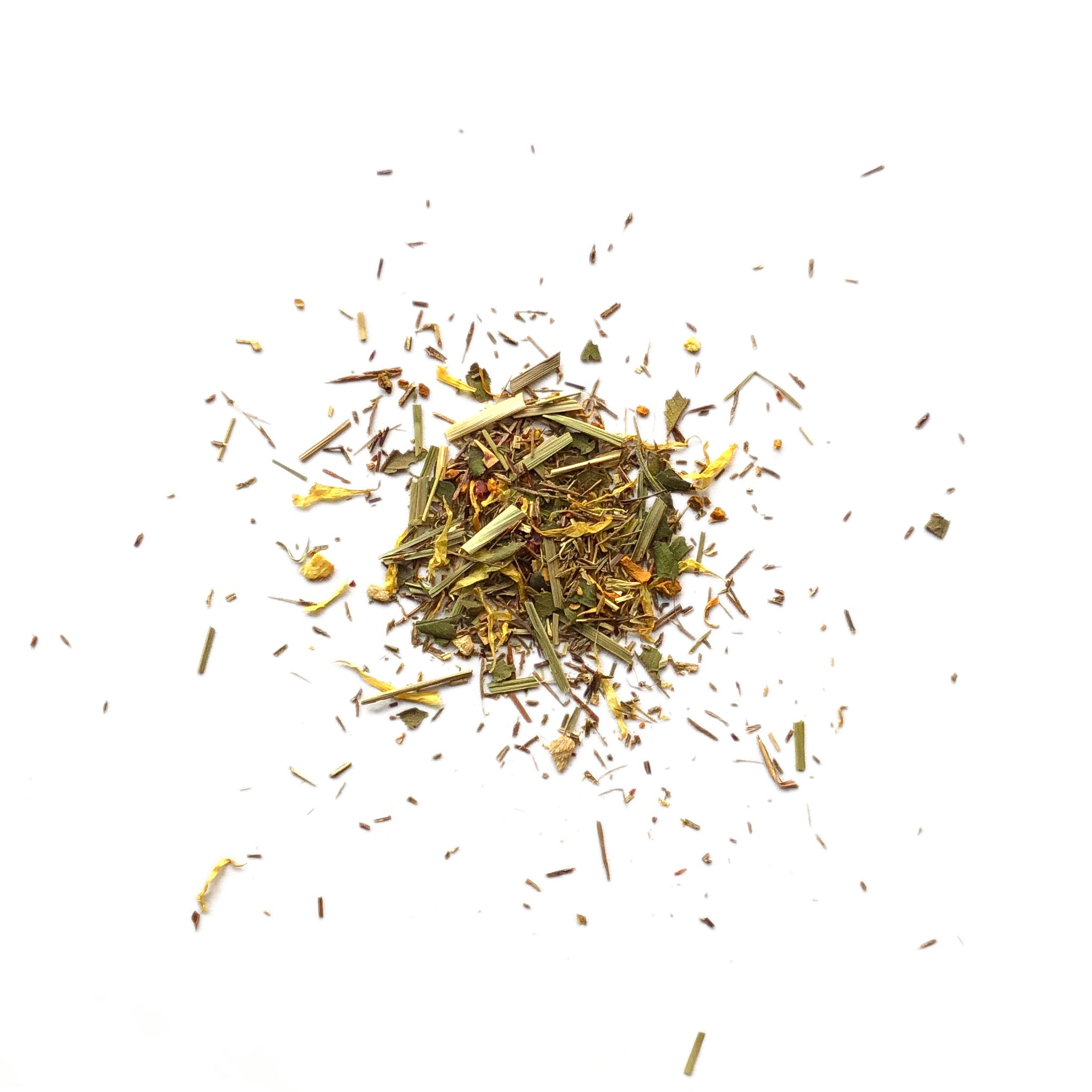 Heap of tea leaves scattered on a white background