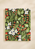 Notebook with floral and leaf pattern on a beige background