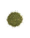 Pile of dried green herbs on a white background
