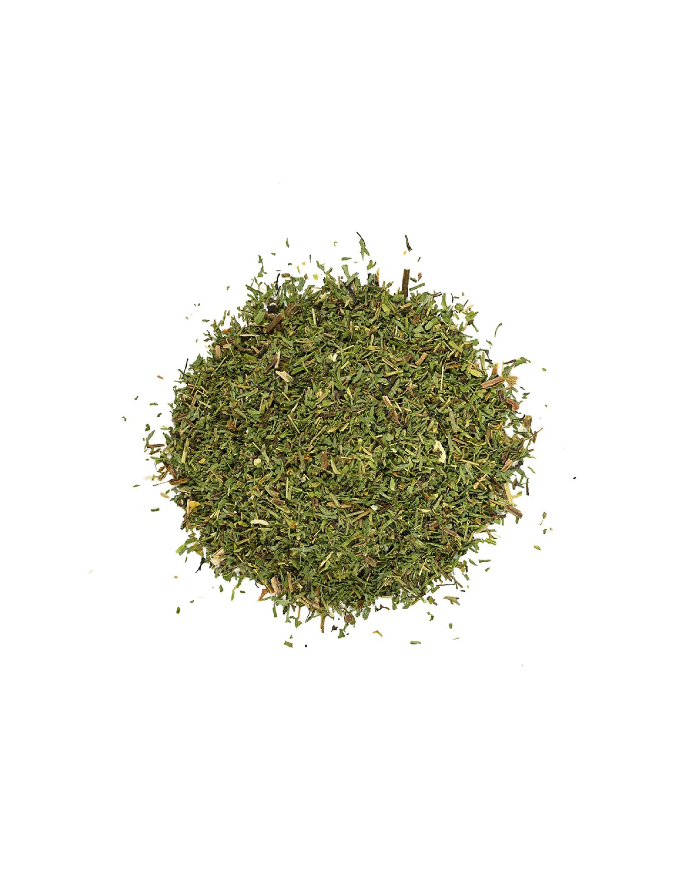 Pile of dried green herbs on a white background