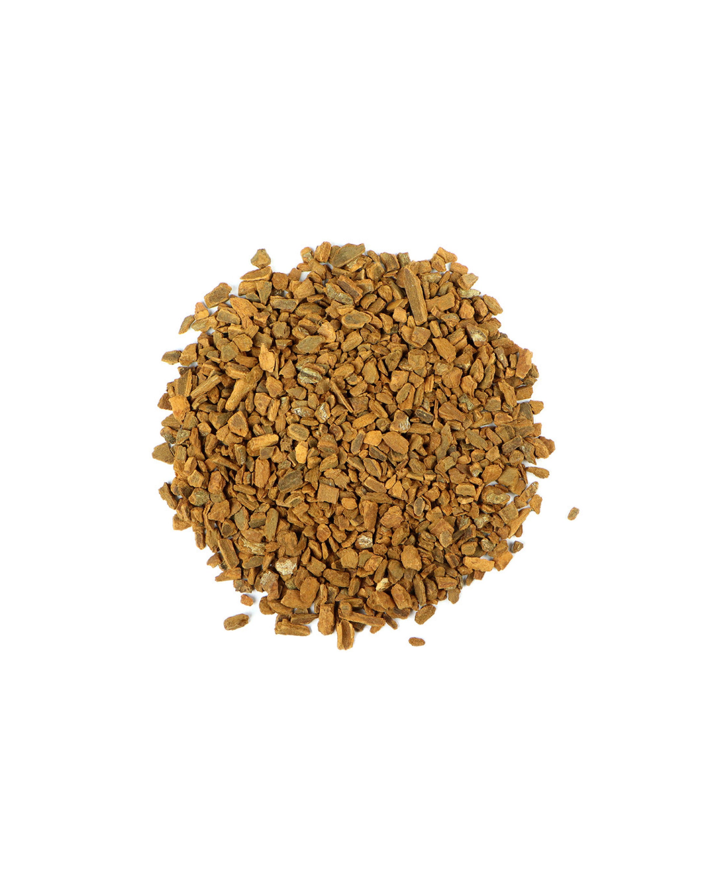 Pile of cinnamon chips on a white background