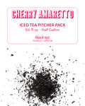 Cherry Amaretto iced tea pitcher pack with black tea leaves on a white background