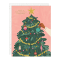 Christmas card with a decorated tree and 'Have a Tree-mendous Christmas!' text on a pink background