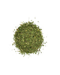 Pile of dried green herbs on a white background