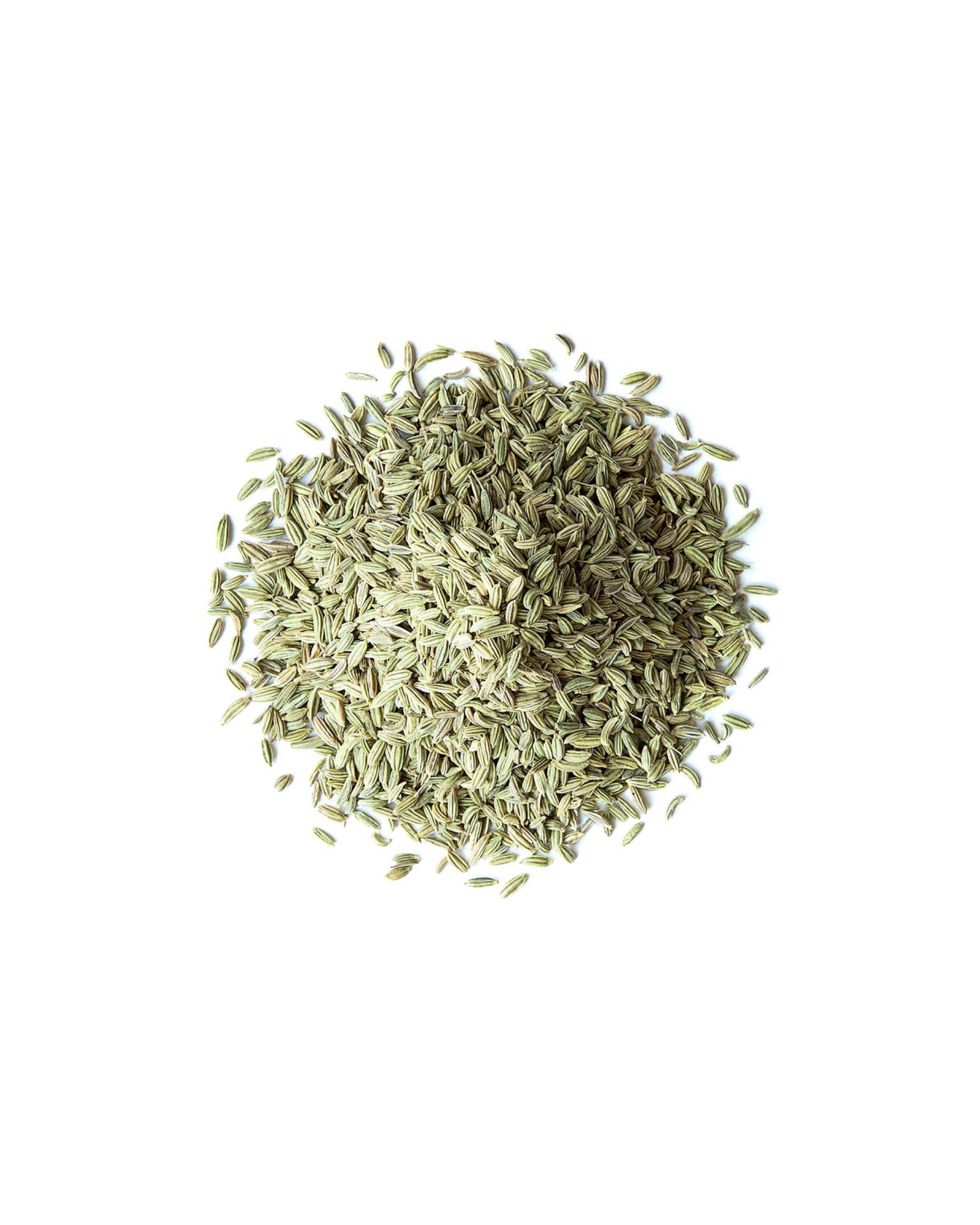 Dried fennel seeds on a white background