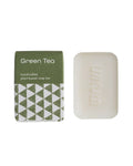 Handcrafted green tea soap bar with packaging on a white background