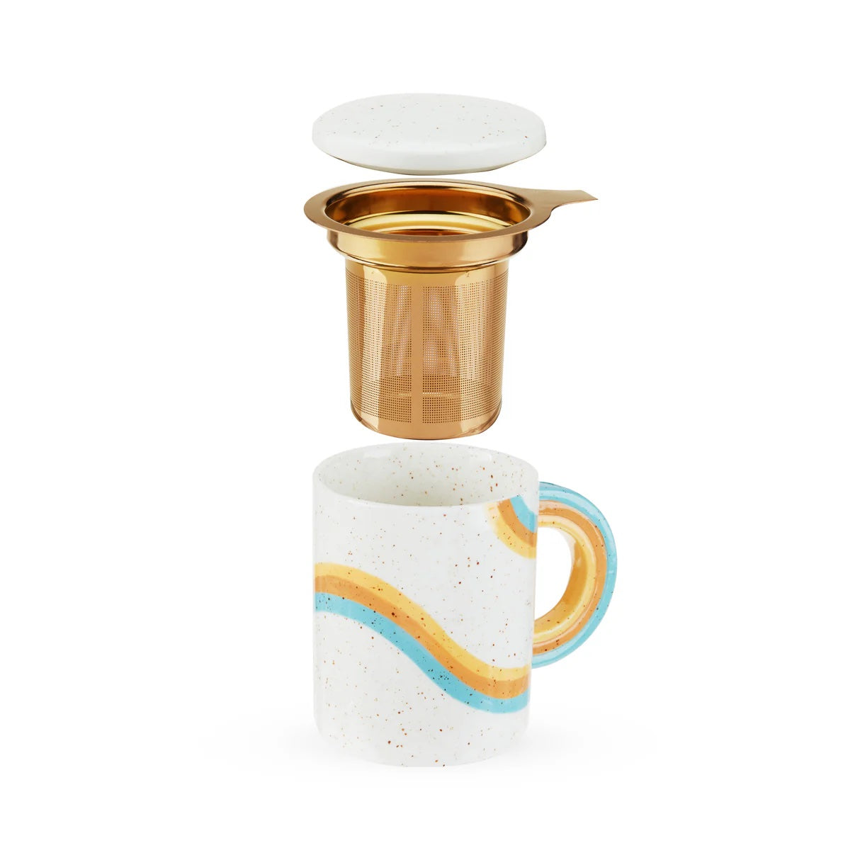 Gold tea infuser over a ceramic mug with a colorful handle on a white background