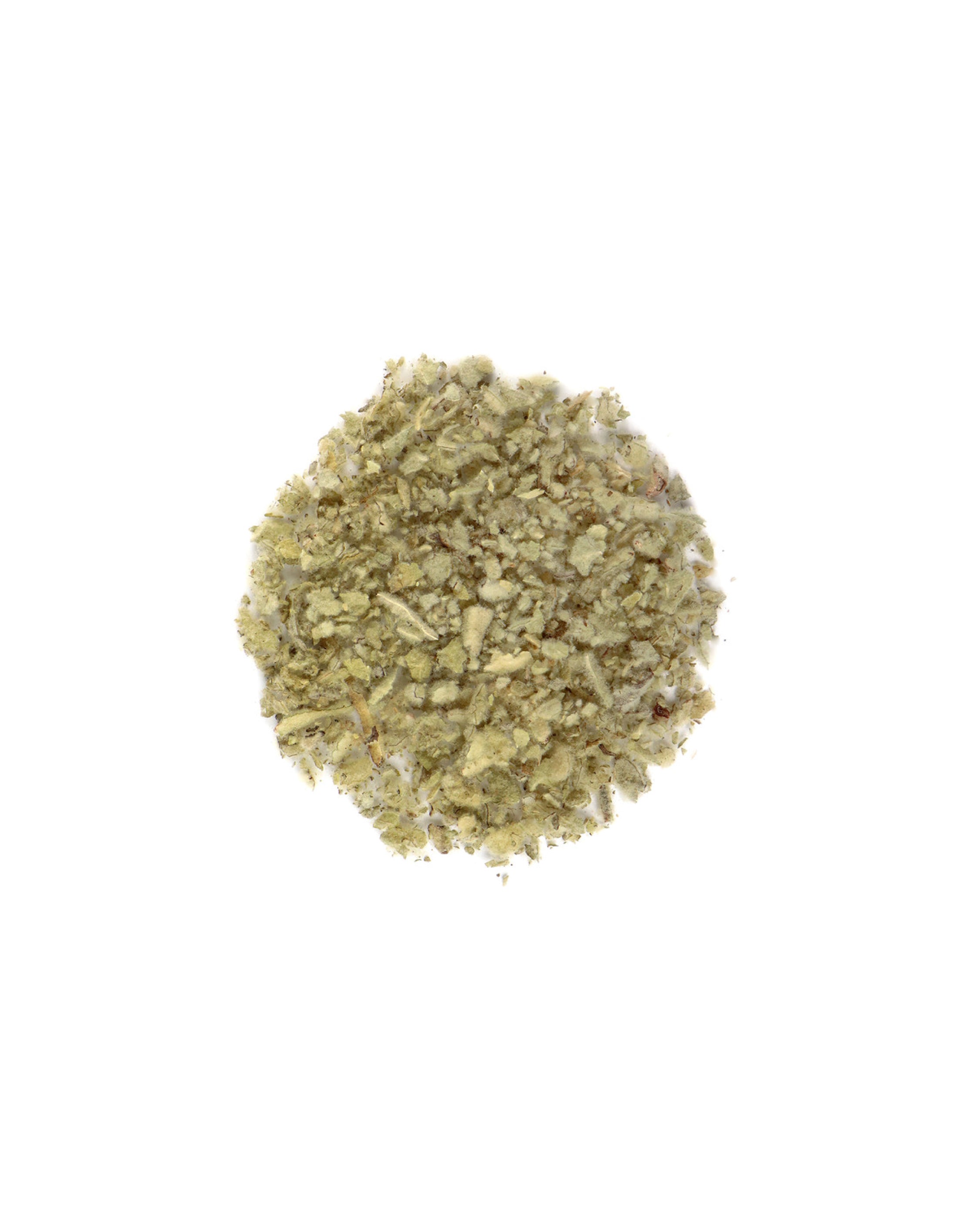 Pile of dried herbs on a white background
