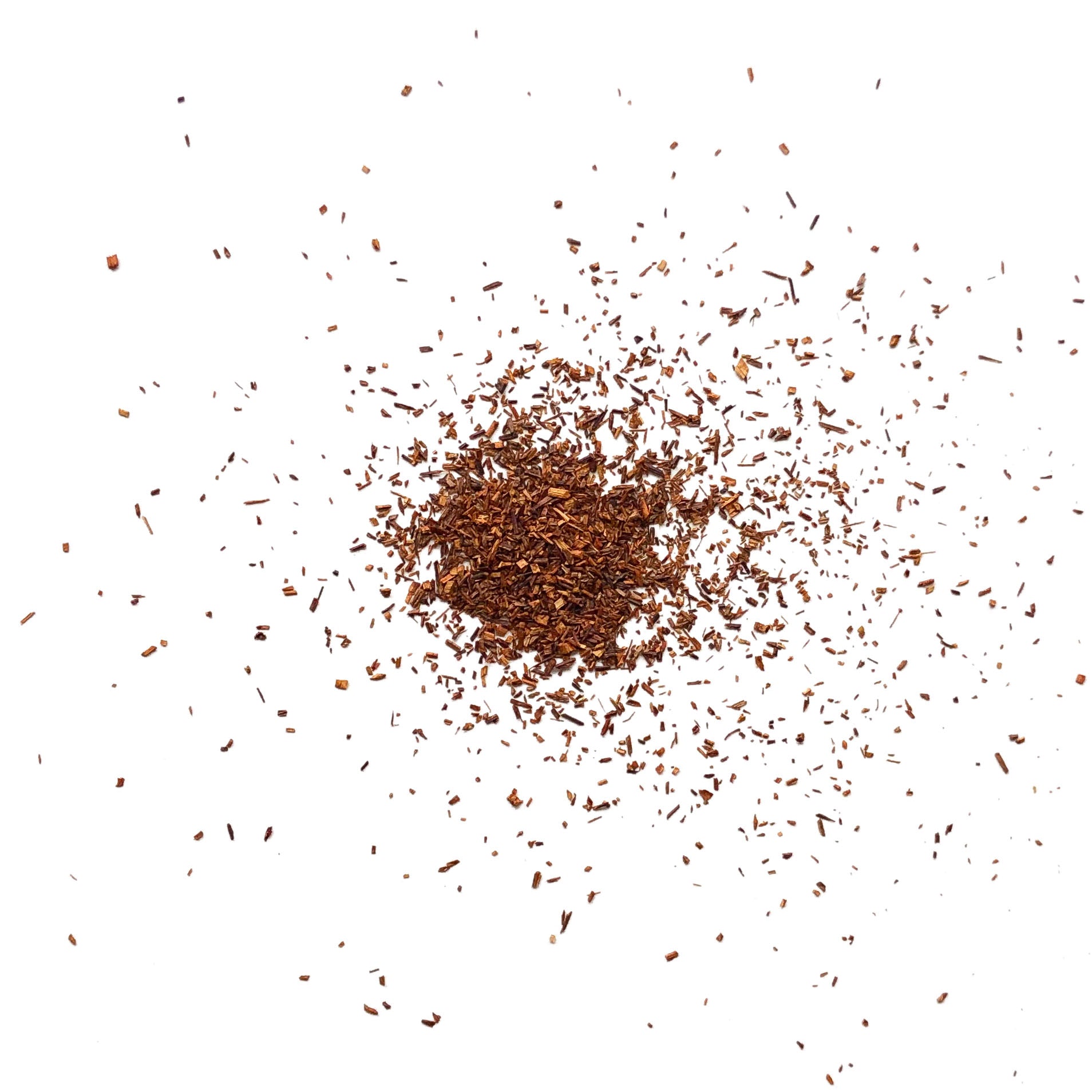 Pile of tea leaves scattered on a white background