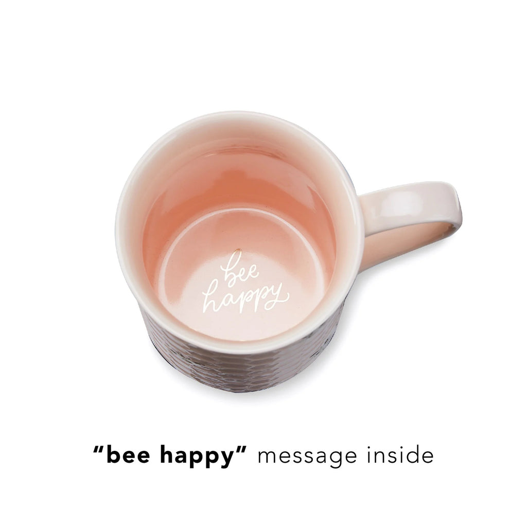 Mug with 'bee happy' message inside on a white background