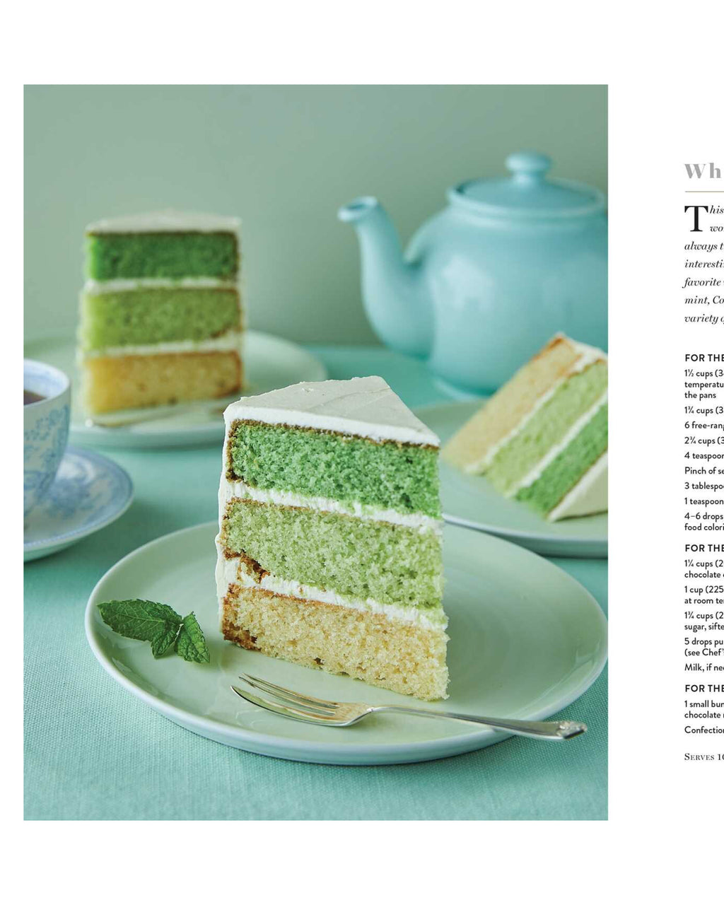 Slice of green layered cake on a plate with a teapot in the background