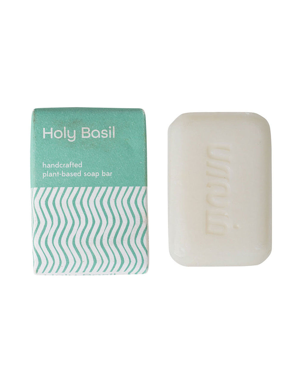 Handcrafted tulsi soap bar with packaging on a white background