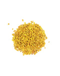 Pile of dried turmeric on a white background
