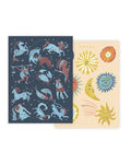 Two notebooks with zodiac designs on a white background