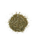 Pile of dried herbs on a white background