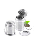 stainless steel tea infuser with a chain on a white background